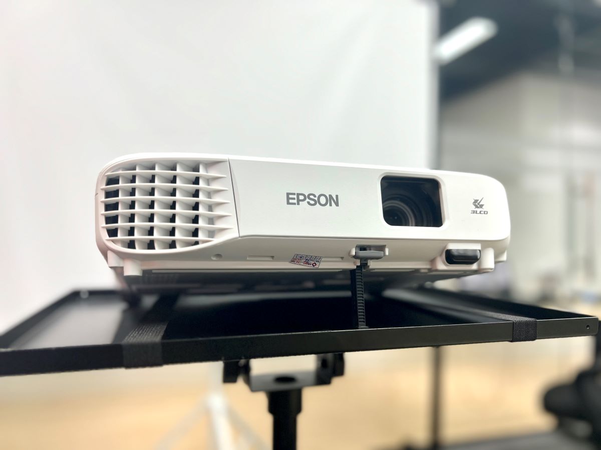 an epson projector on a tripod stand looked from front