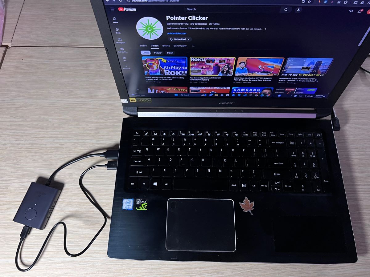 An Acer laptop is connected with an HDMI transmitter