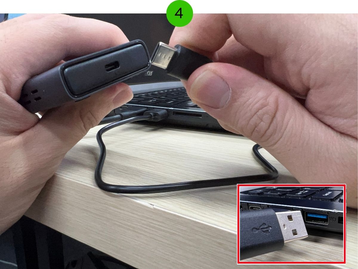 Human hands is connecting the HDMI transmitter to the USB-C to power up the device