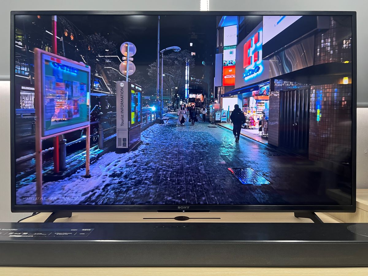 Sony TV with the LG sound bar on a wooden table