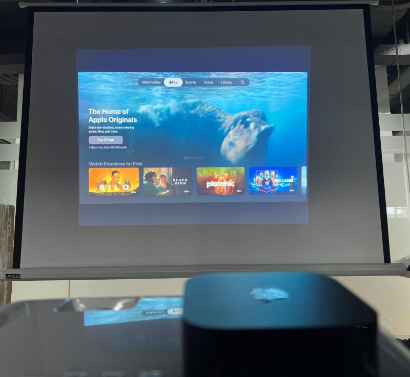 Apple TV home screen on projector screen