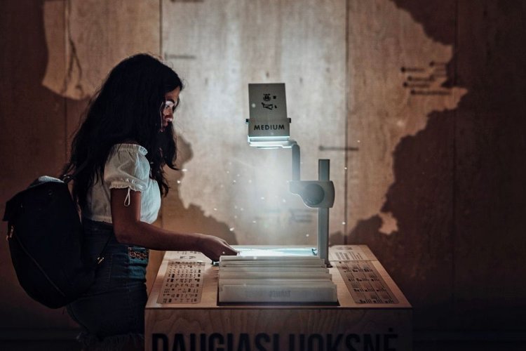 a woman using overhead projector