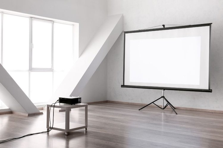projector on a table with projector screen