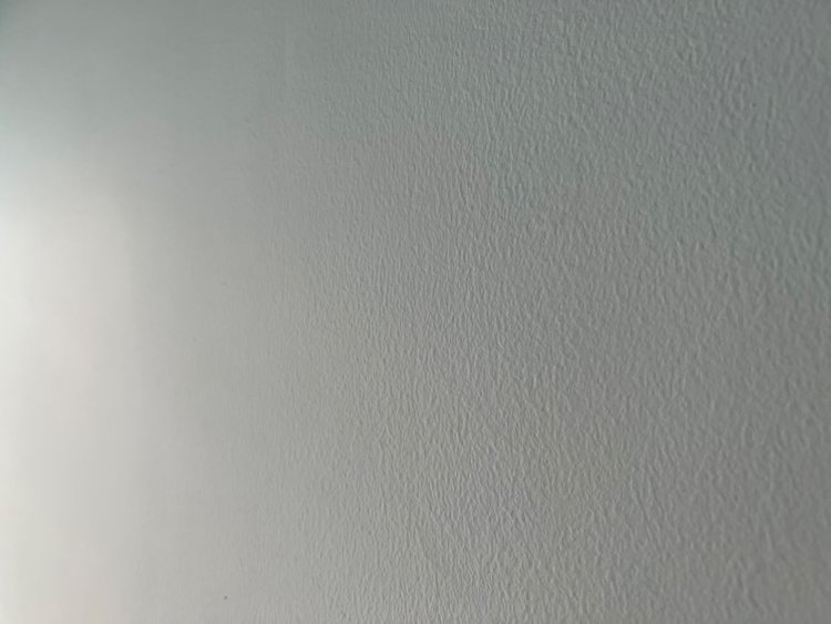 white uneven wall with sun light