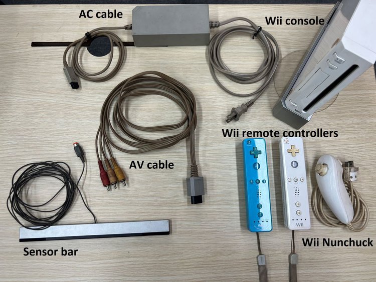 Inside the box of the Wii console with the cables and the controllers