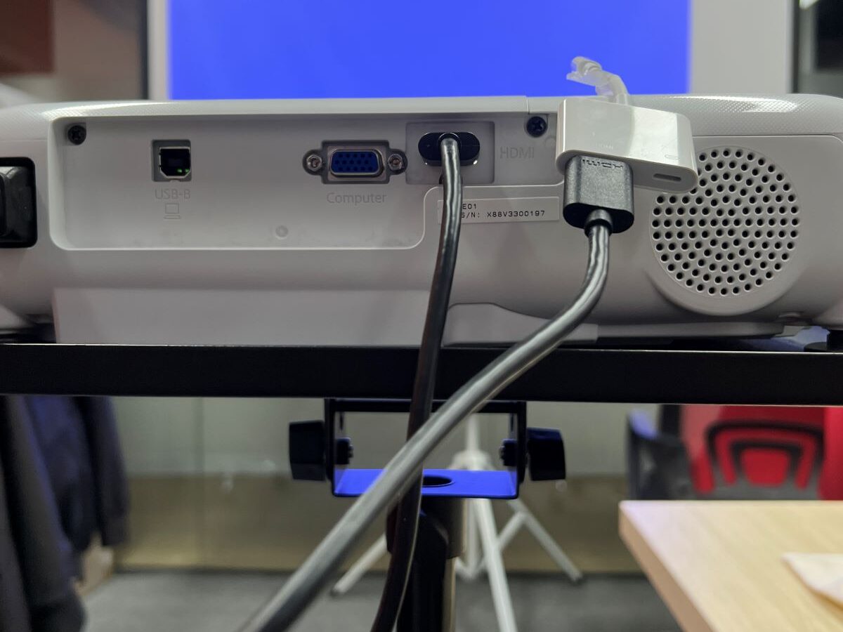 The Lightning HDMI adapter is connected to the Epson projector via an HDMI cable