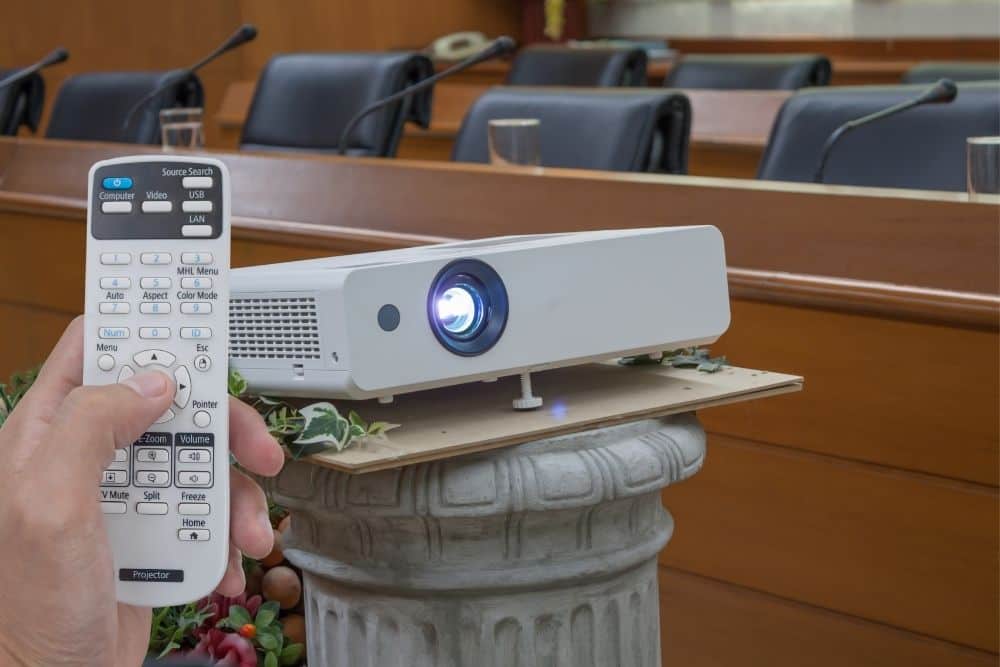 use a remote to adjust the brightness of a projector