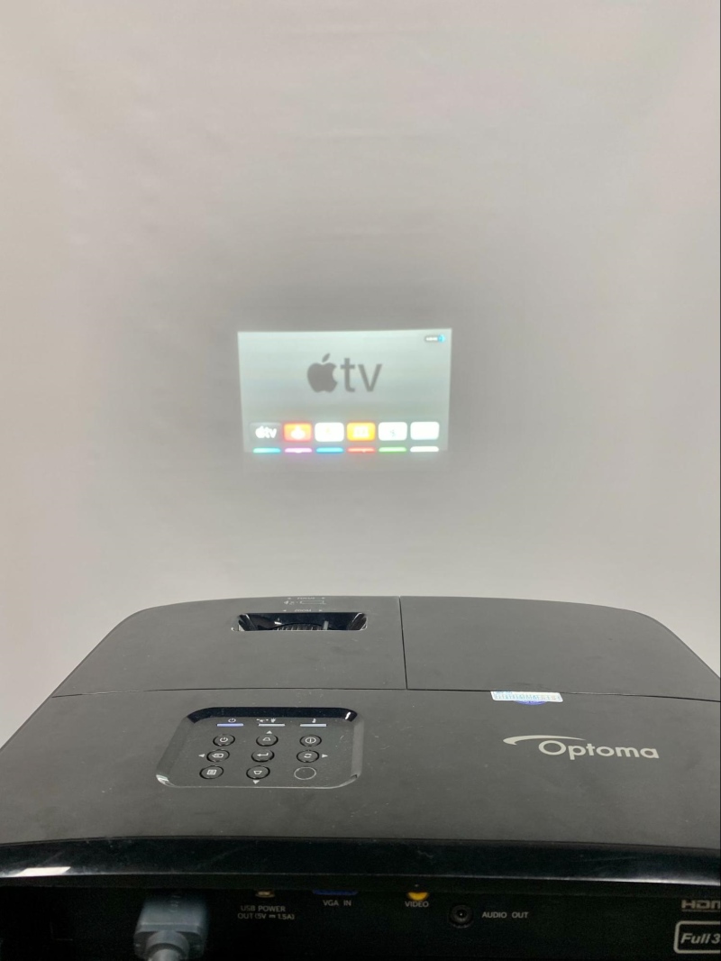 Apple TV home screen shows from Optoma projector