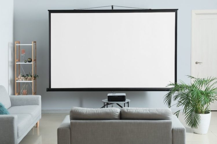 big projector screen with a projector in a room