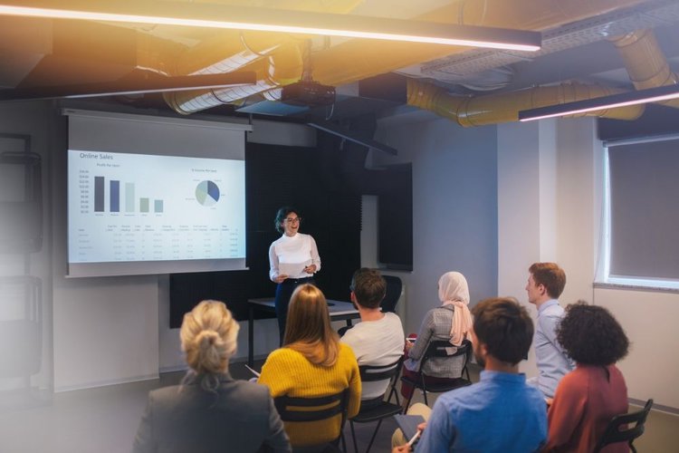 woman doing a business presentation with a projector