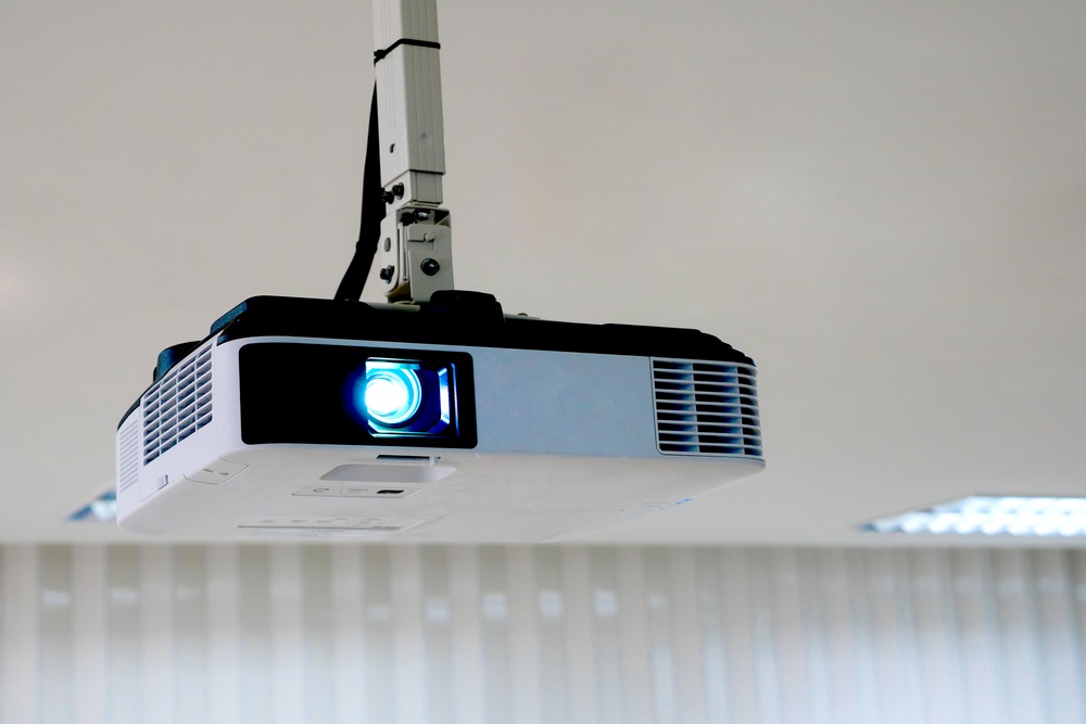 A projector mounted onto the ceiling