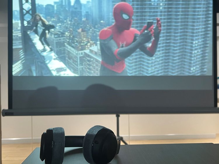 Spider man movie on a projector screen with a Beat headphones