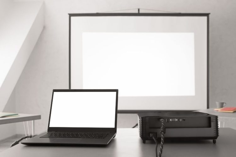 A projector connects to laptop