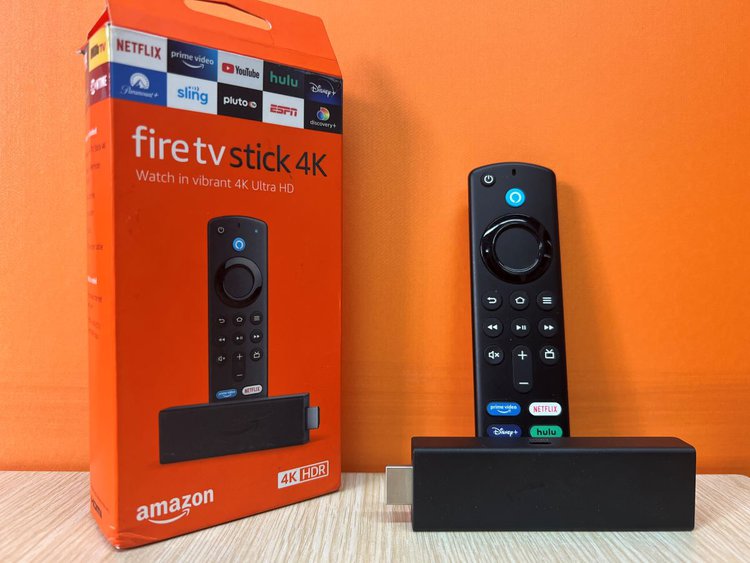 Fire TV Stick with an orange background