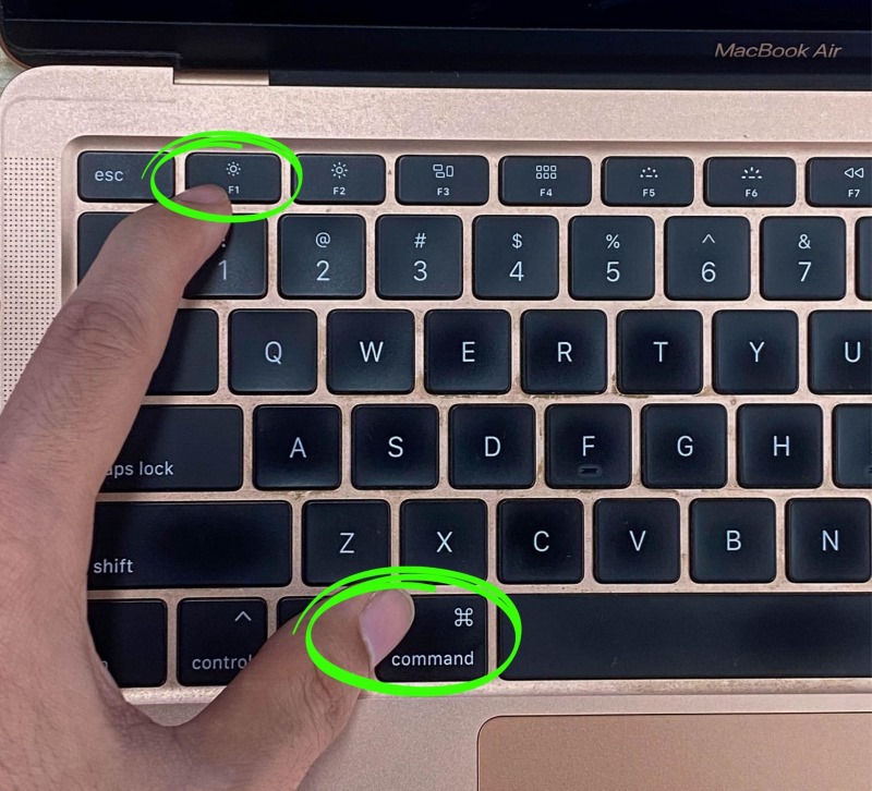press the Command and F1 keys at the same time on the Macbook Air keyboard