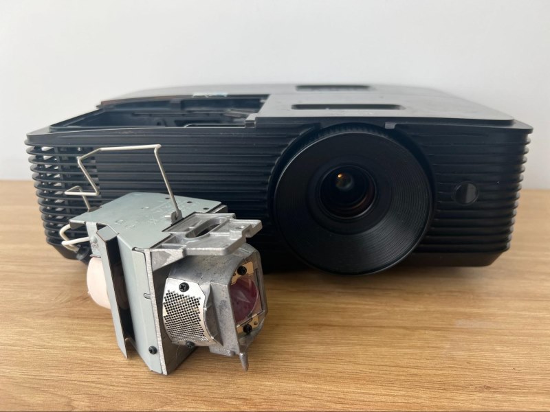 A projection lamp in front of an Optoma projector