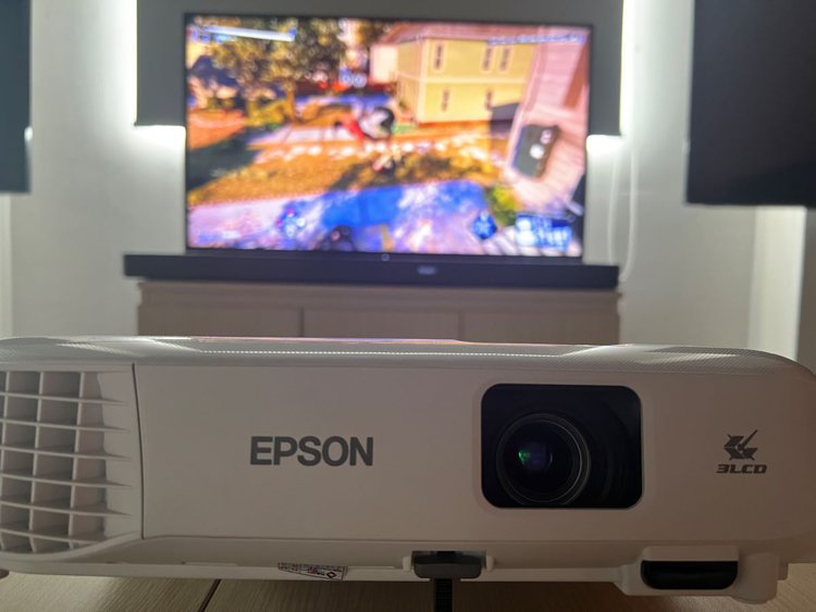 Epson projector on the table and Sony TV at the back