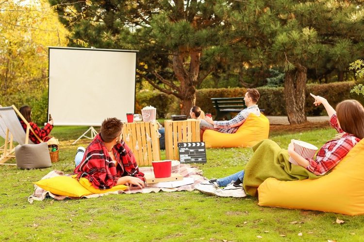 a group of friends enjoying outdoor movie