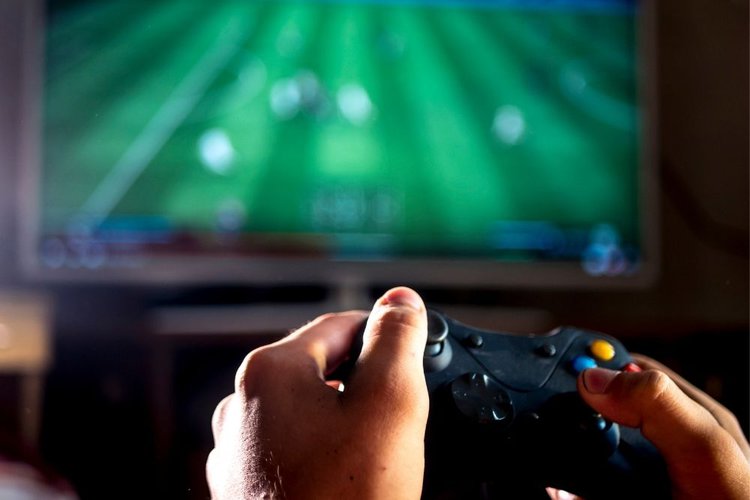 a person playing game on TV