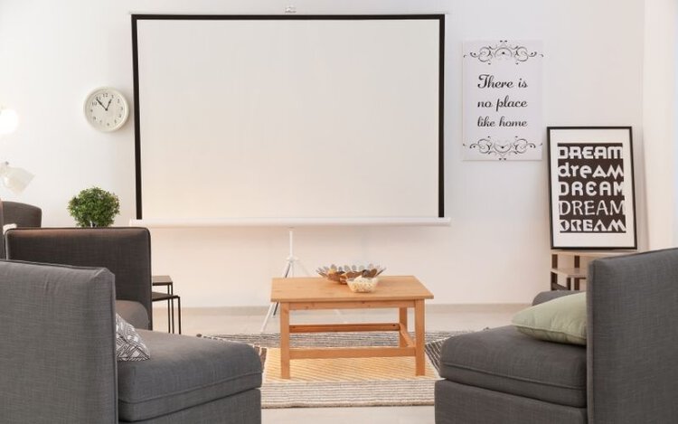 a projector screen placed in a bright room