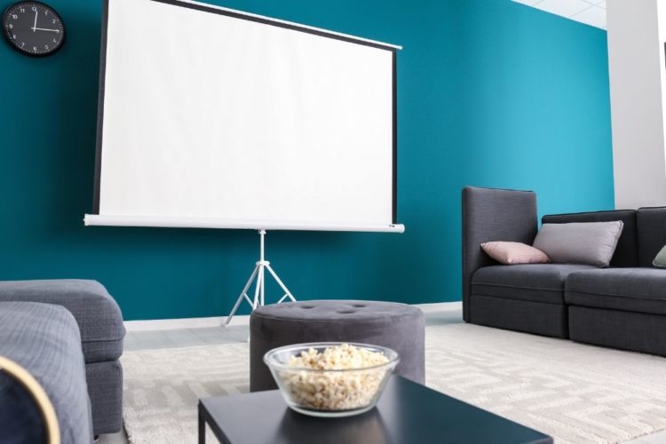 a projector screen placed in a room