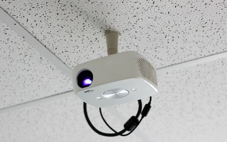 a ceiling-mounted white projector