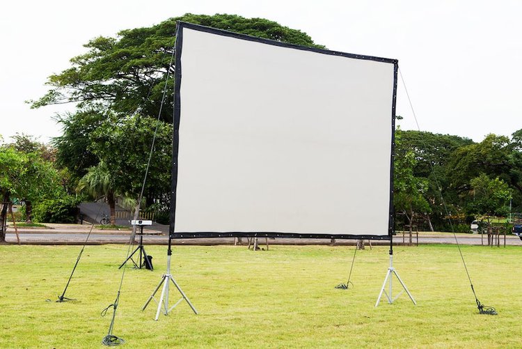 an outdoor projector screen on a yard
