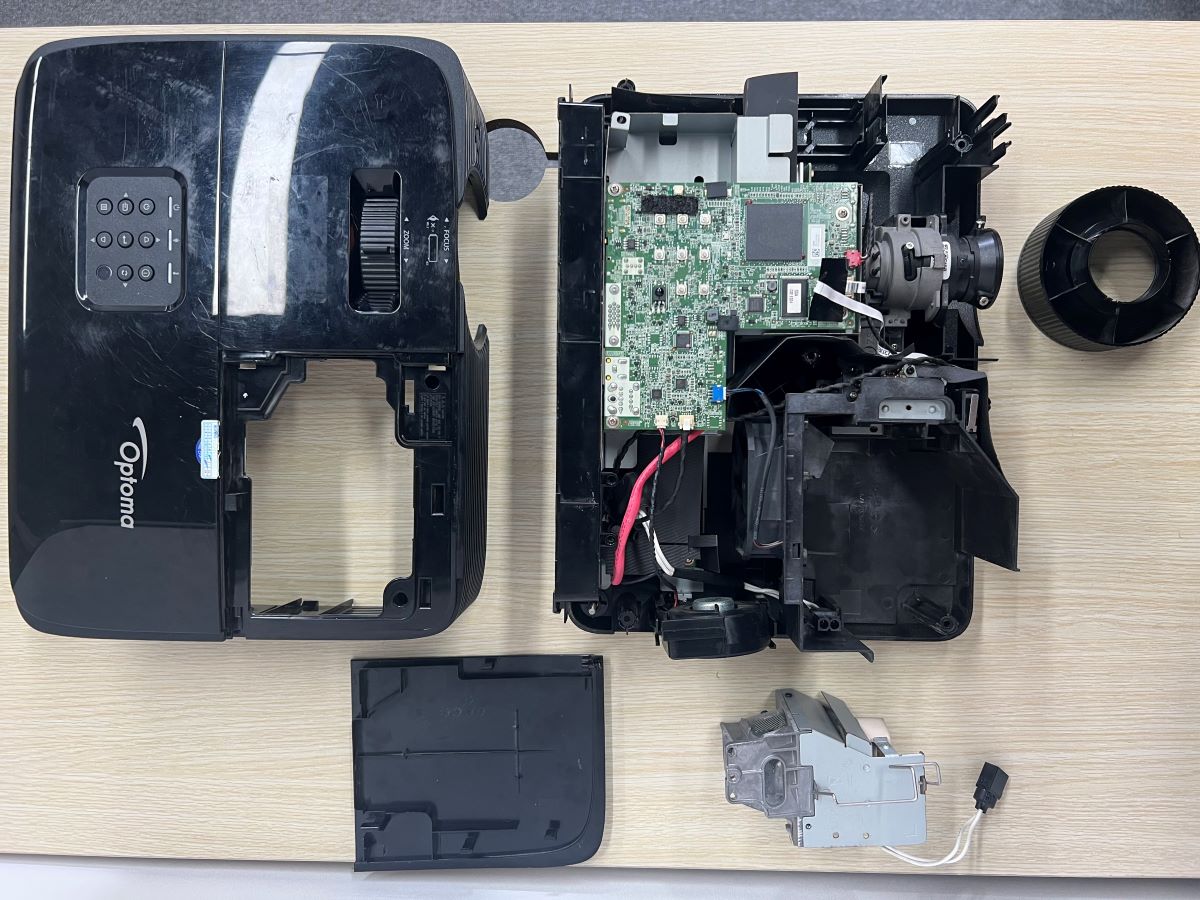 All of the parts of the Optoma projector are removed out of the projector