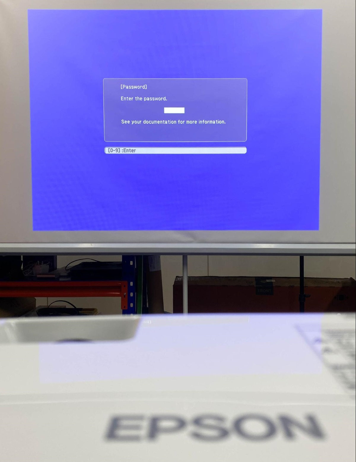 Epson projector is displaying the Enter password screen