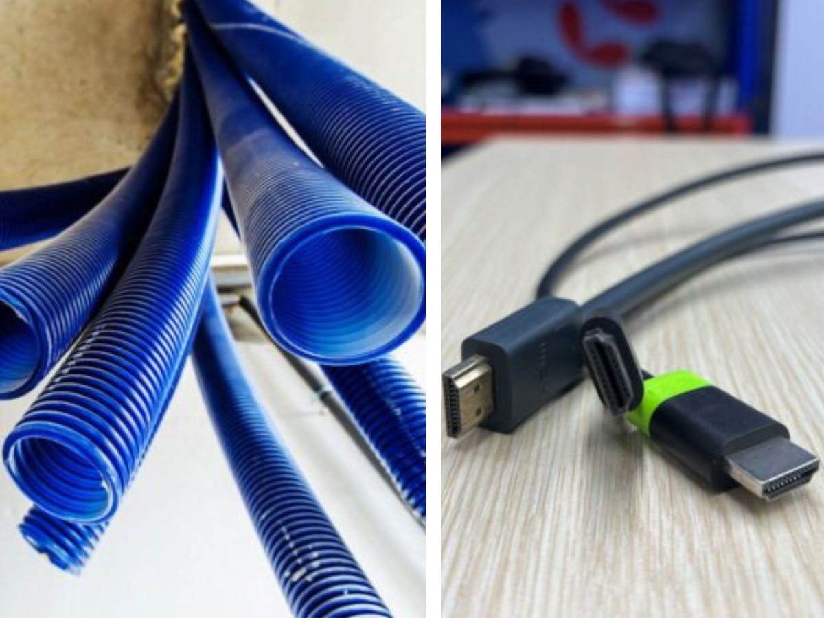 The blue conduits on the left and multiple HDMI cables on the right of the image