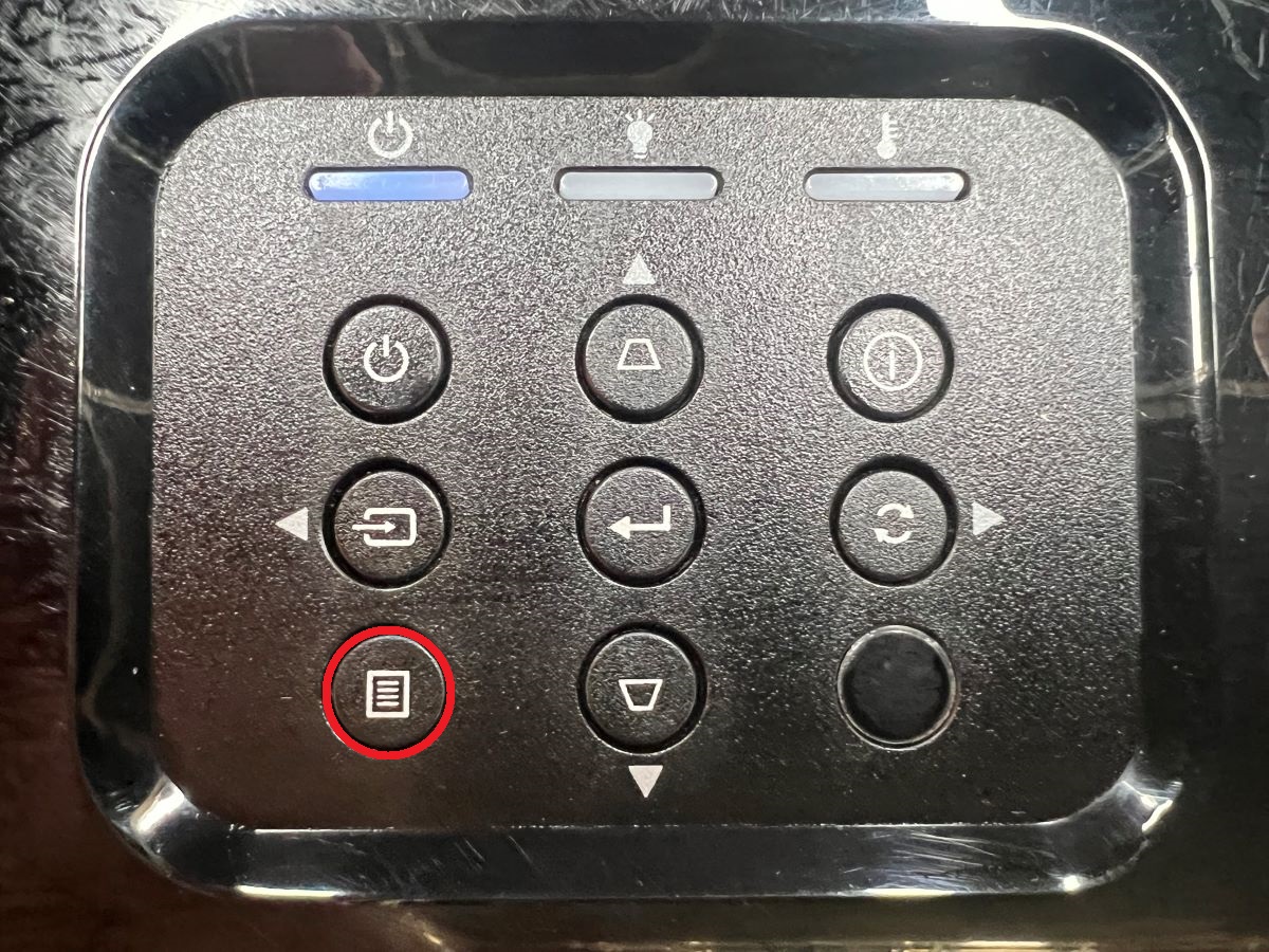 The menu button on the control panel of the Optoma projector