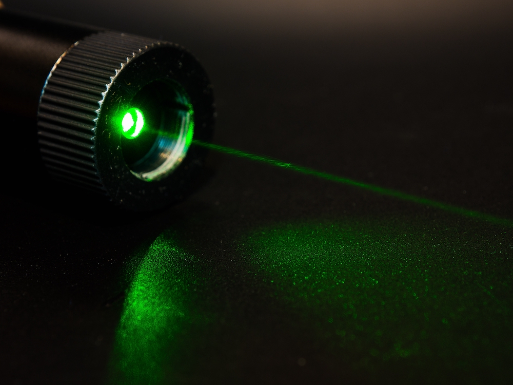 a green laser pointer in the dark