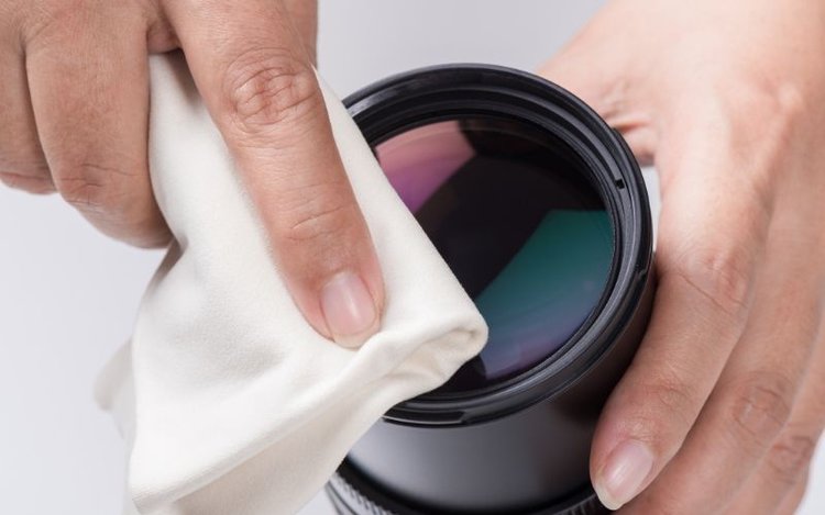 cleaning a projector lens using a soft towel