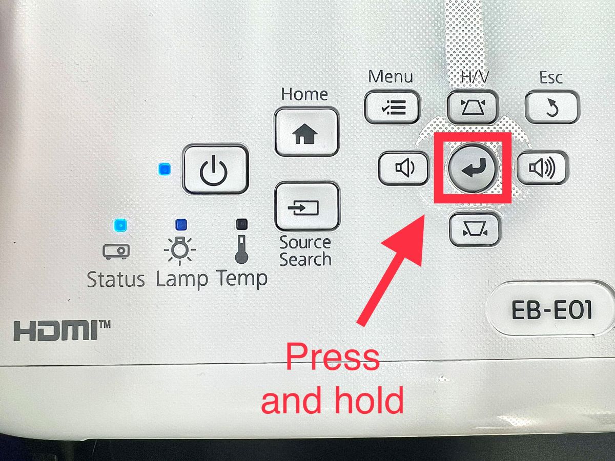 enter button on an epson projector is highlighted and pointed at