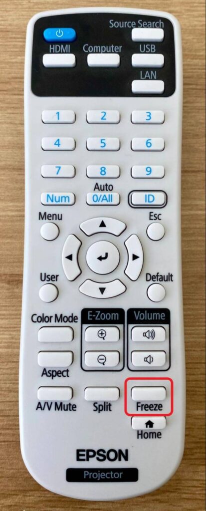 highlighted Freeze button on the Epson projector remote