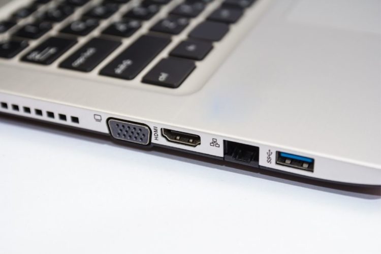 A VGA port on a gray laptop