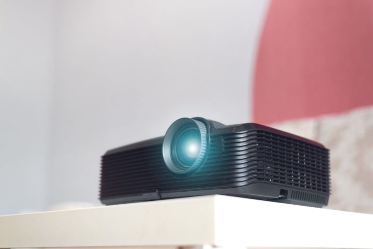 A black projector in a living room