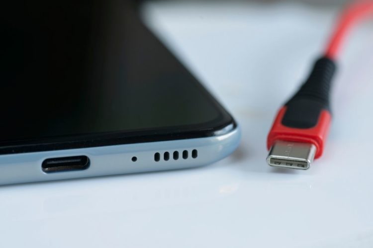 A close-up of smartphone port and a cable