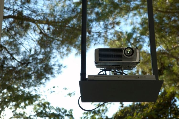 A projector placing on a high place outdoor