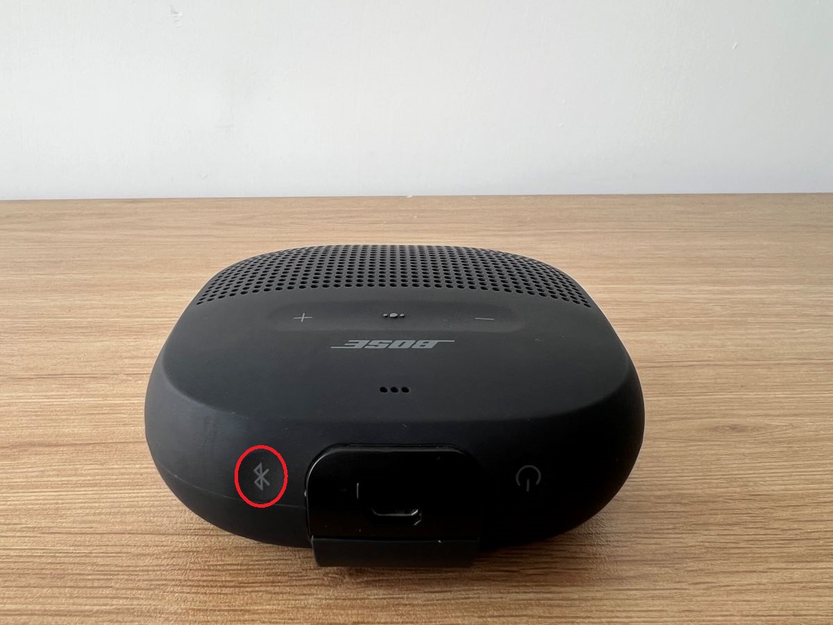 Bose Bluetooth speaker with the button is being highlighted