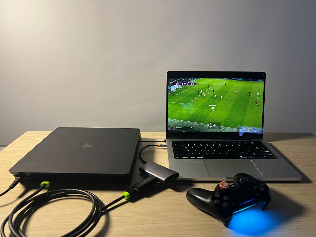 PS4 is playing a football game on MacBook using HDMI capture card