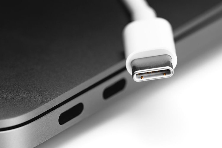 USB-C ports and a white USB-C cable