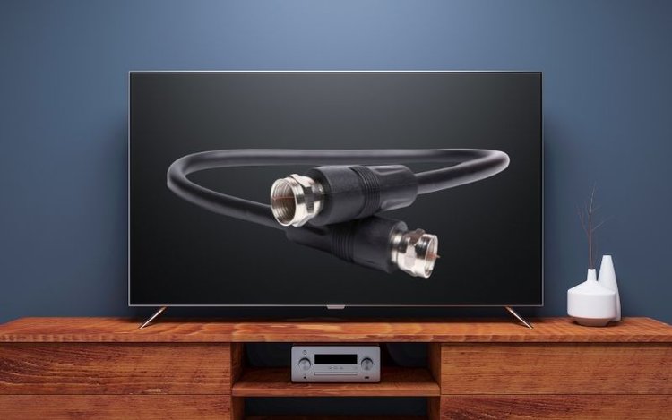 a smart TV with a black coaxial cable image