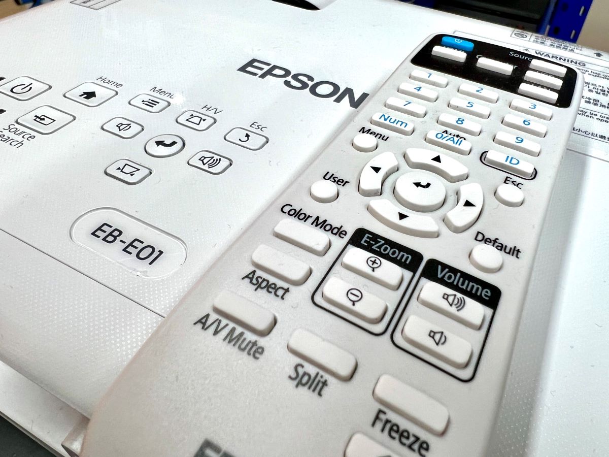 epson remote is laying on epson projector