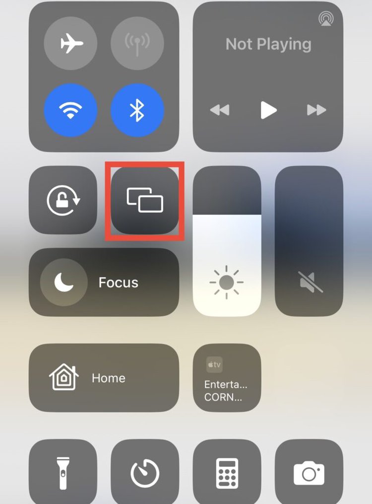 iphone's quick menu with screen mirroring feature highlighted
