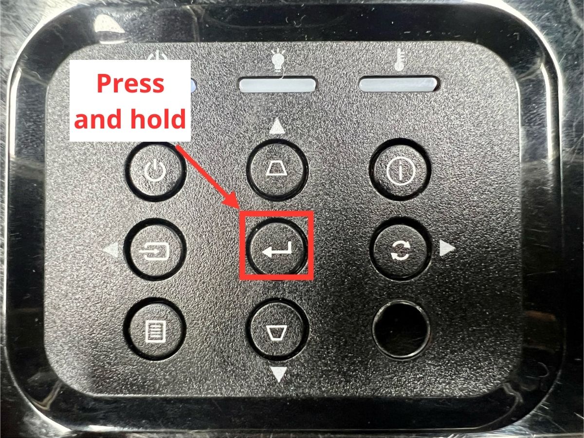 press and hold the enter button on an optoma projector