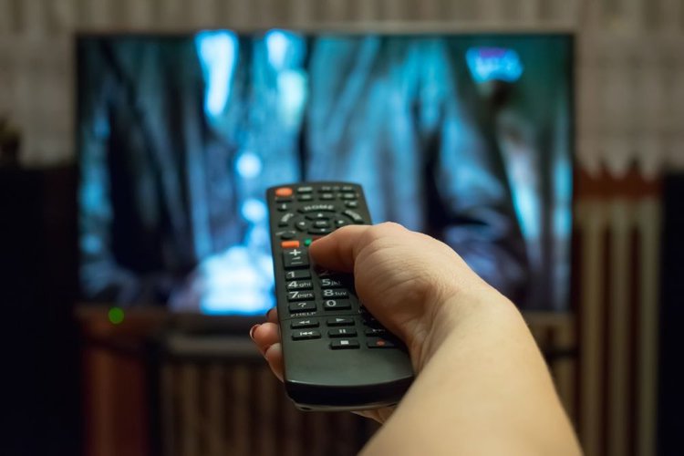 A TV playing film with remote control