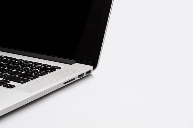 A white Macbook on a white background