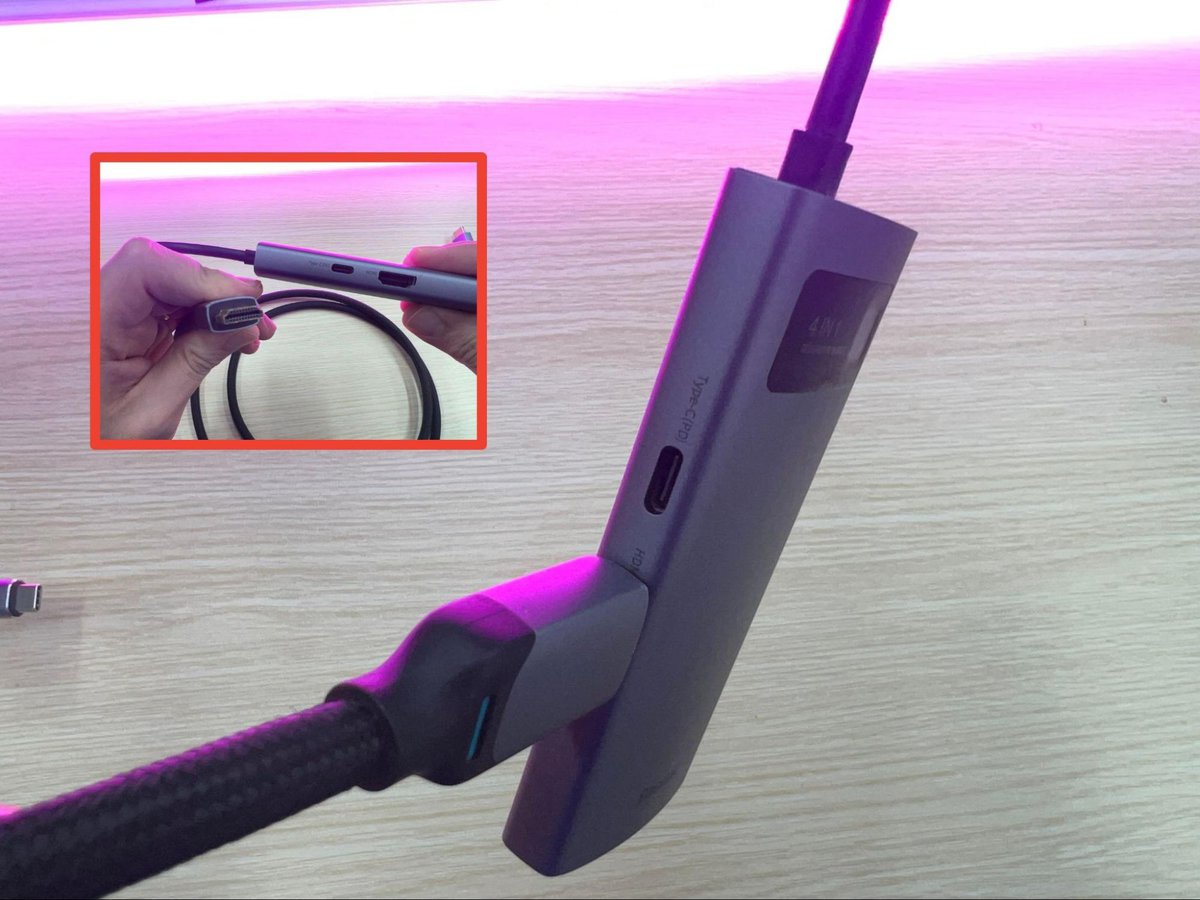 An HDMI cable is plugged to the USB-C hub via HDMI port