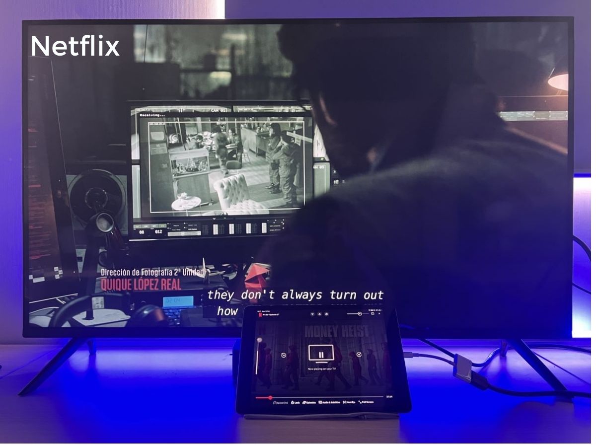 An iPad is connected to TV via Lightning to HDMI adapter and streaming Netflix